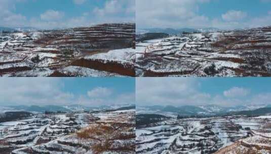 冬季白雪覆盖红土地山川田野远处连绵雪山高清在线视频素材下载