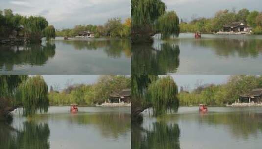 扬州瘦西湖阴雨天在雨中行驶的摇橹船及船娘高清在线视频素材下载