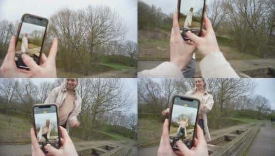 女人使用手机为闺蜜拍照高清在线视频素材下载