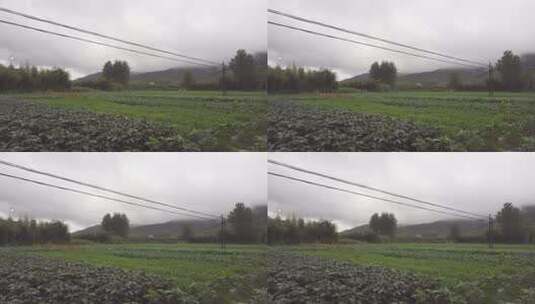 雨后农田的上空布满乌云和一层云雾高清在线视频素材下载
