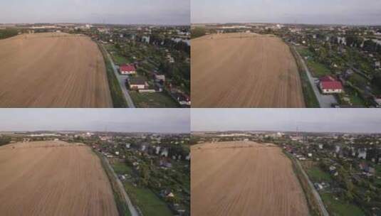 仲夏，捷克再保险公司，一架缓慢的无人机飞越一个被田野和池塘包围的村庄高清在线视频素材下载