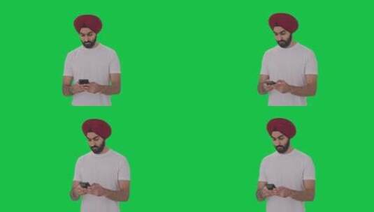 愤怒的锡克教印度人给某人发短信绿屏高清在线视频素材下载