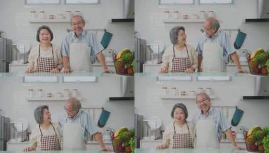 亚洲老年夫妇的肖像幸福地站在厨房里，微笑高清在线视频素材下载