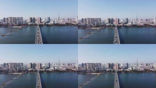 大桥中轴车流飞向城市高清在线视频素材下载