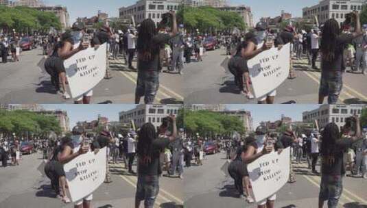 人们举着标语抗议集会高清在线视频素材下载