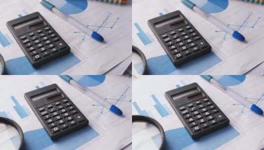 桌上的财务图表计算器和记事本高清在线视频素材下载