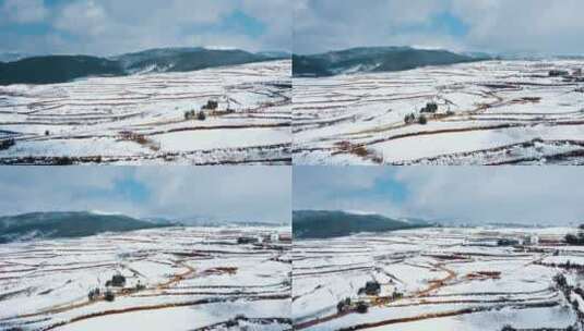 晴天蓝天下阳光照耀冬季白雪覆盖山川田野高清在线视频素材下载