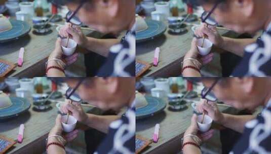 陶艺大师在瓷胚上艺术绘画高清在线视频素材下载