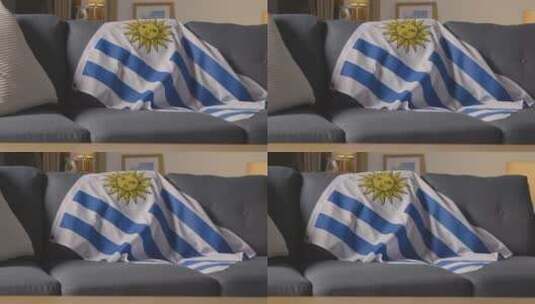 沙发上的旗帜和足球高清在线视频素材下载