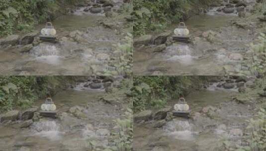 茶叶包装在溪流里高清在线视频素材下载
