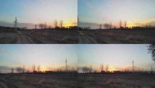 4K北方冬天农村输电塔与夕阳日落美景高清在线视频素材下载