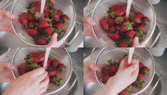 在厨房水龙头下洗草莓的女人高清在线视频素材下载
