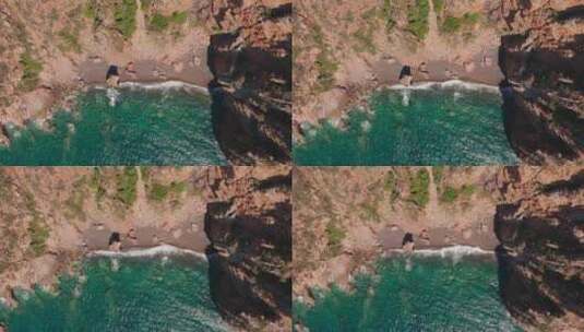 红沙海滩海浪压碎海滩的空中俯视图高清在线视频素材下载