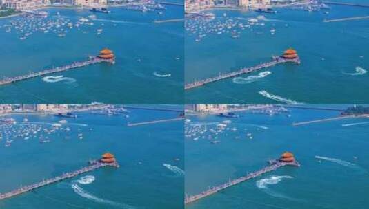 蓝天白云之下的青岛栈桥风景区航拍高清在线视频素材下载