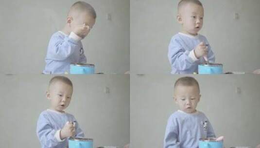 使用勺子学吃饭的小男孩幼童高清在线视频素材下载