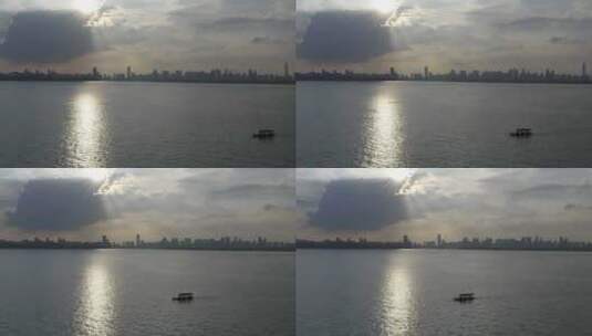 航拍武汉东湖梅园码头黄昏湖面小船高清在线视频素材下载
