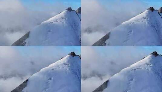 航拍攀登横断山脉乌库楚雪山山脊上的登山者高清在线视频素材下载