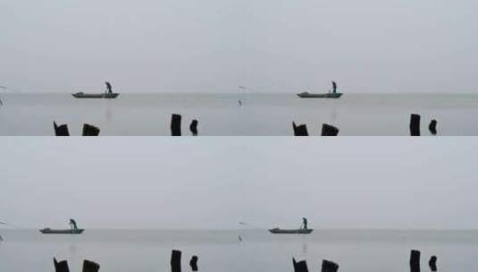 晚秋早晨江面雾气与渔船捕鱼人水墨画高清在线视频素材下载
