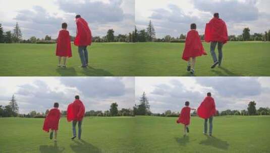穿着红色斗篷的父亲和男孩在草原上奔跑高清在线视频素材下载