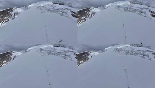 航拍攀登慕士塔格峰雪山冰川的登山队高清在线视频素材下载