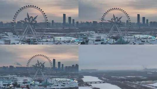 航拍哈尔滨冰雪大世界晚霞夕阳朝霞灯光夜景高清在线视频素材下载