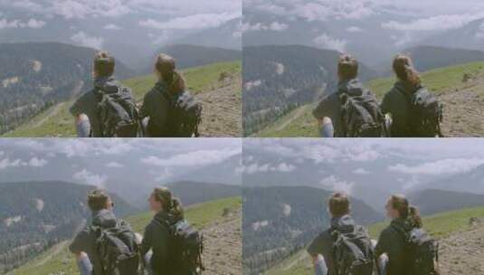 一对夫妇在山顶上欣赏风景高清在线视频素材下载