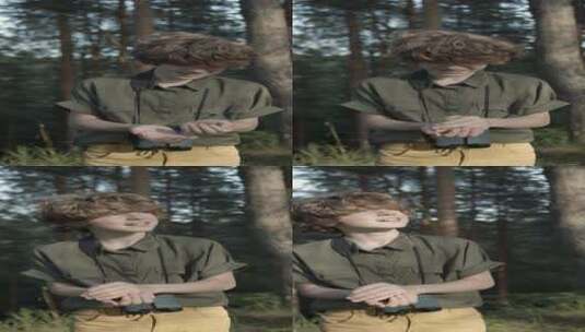 森林里的男孩竖屏镜头高清在线视频素材下载