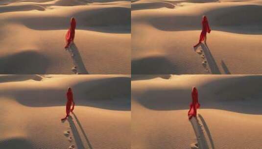 航拍沙漠中的红衣女子高清在线视频素材下载