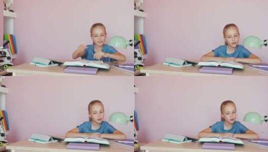 可爱的女孩在卧室做作业高清在线视频素材下载