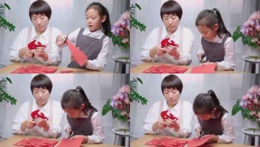 一起做手工剪纸的中国母女高清在线视频素材下载