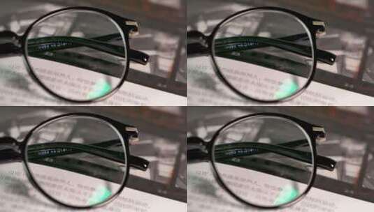 书本上的眼镜特写镜头【4K】高清在线视频素材下载