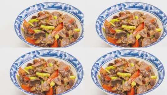 芹菜炒鸡杂美食菜品4k滑轨平移高清在线视频素材下载