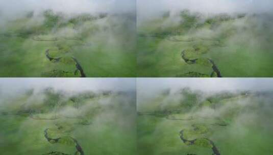 航拍晨雾缥缈的原野曲水高清在线视频素材下载
