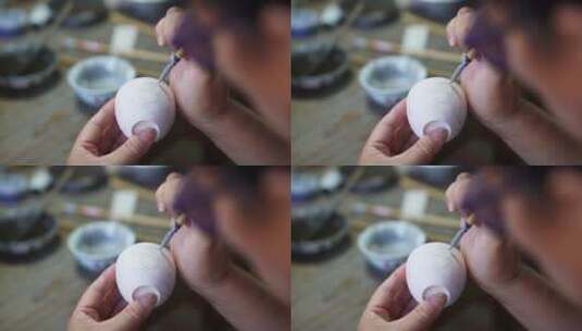 陶艺大师在瓷胚上艺术绘画高清在线视频素材下载