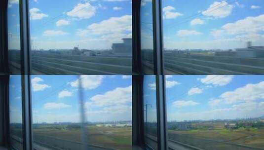 行驶中的高铁动车窗外小镇景观高清在线视频素材下载