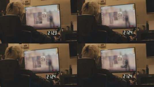 一个人坐在电脑前打游戏高清在线视频素材下载