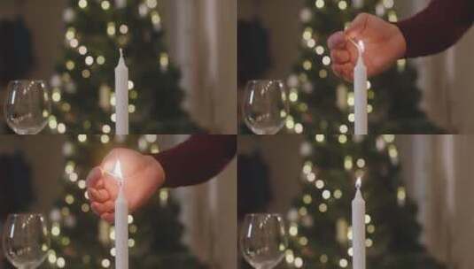 男人的手为圣诞晚餐点燃蜡烛高清在线视频素材下载