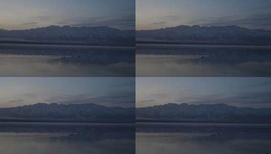 新疆赛里木湖晚霞霞光雪山湖泊高清在线视频素材下载