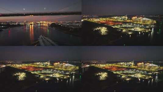 城市航拍货轮穿过大桥夜景灯光港口高清在线视频素材下载