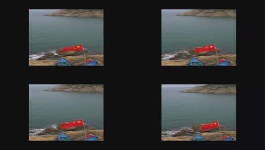 海滩上飘扬的国旗高清在线视频素材下载