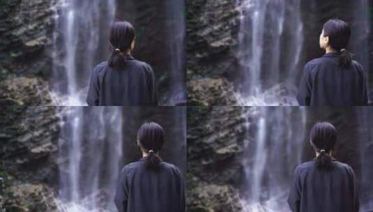 女性游客背影面向山水感受亲近自然山峰瀑布高清在线视频素材下载