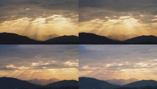 阳光穿透云层照射山峰阳光森林丁达尔太阳光高清在线视频素材下载