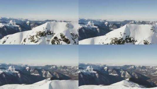 站在雪山天线顶峰脊上的人高清在线视频素材下载