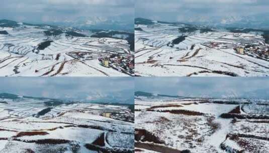 冬季白雪覆盖山川田野农村远处连绵雪山高清在线视频素材下载