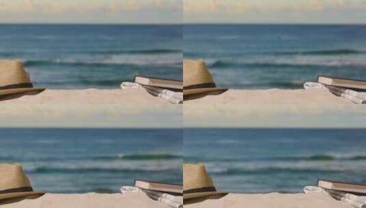 夏季假期概念沙滩上的太阳帽书籍高清在线视频素材下载