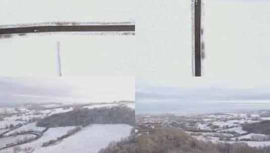 冬季山区雪后景观的乡村道路的航拍高清在线视频素材下载