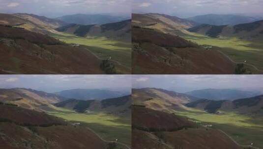 航拍新疆云彩投影在绿色的山谷中高清在线视频素材下载