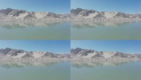 新疆风化山丘旁湖中央航拍高清在线视频素材下载