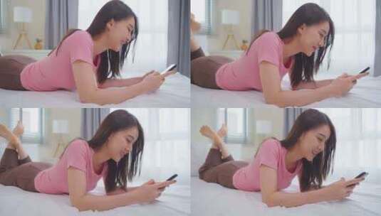 亚洲有魅力的女人早上在家床上用手机聊天。高清在线视频素材下载