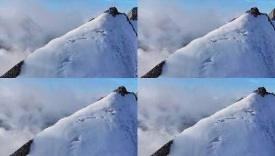 航拍攀登横断山脉乌库楚雪山山脊上的登山者高清在线视频素材下载